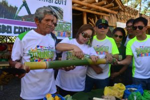 Pugo Mayor Priscilla Marrero-Martin places the rice inside the bamboo which was used by local residents in the recently concluded 1st Tinungbo festival cookfest held in Pugo La Union over the weekend. Rosalia T. See