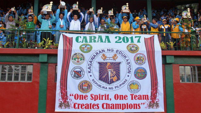 WE ARE THE CHAMPIONS. Baguio city Mayor Mauricio Domogan proudly raises the CARAA 2017 overall championship during the concluding rites last February 8, 2017 at the Baguio Athletic Bowl. Also in the photo are representatives from silver medalist Benguet and bronze medalist Mountain Province. Photo by RJ Cayabyab. 
