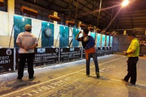LAST TWO STANDING - Alexis Toylo, the eventual Open Singles Champion, aims the winning throw, while runner-up Ricky Mijares waits for his turn during the Panagbenga 2017 National Darts Tournament last February 17-19, 2017 at Barangay Engineer’s Hill Covered Court. Photo by AJ Magalong, UB intern. 