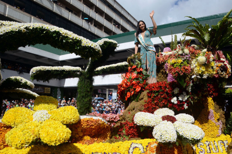 Reigning Miss International Kylie Versoza, a Baguio girl, waves to the crowd as she parades aboard the Pepsi Cola float during the recent Panagbenga Grand Float competition. Photo by RMC PIA-CAR.