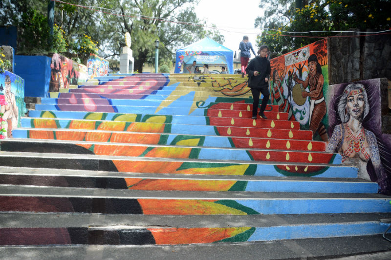 The G.I.N.T.O (Guild of Integrated Talents) Baguio, group of local artists in Baguio City turned the Post Office Park into another lively artwork inspired by the rich culture and tradition of the Baguio City, Benguet and the Cordillera region including the Panagbenga festival. The artwork was unveiled in time for the Panagbenga festivities. Here, a father and daughter enjoys photo opportunities with the colourful artwork as background. (March 5, 2017) REDJIE MELVIC CAWIS, PIA-CAR.