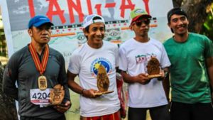 WE WILL ROCK YOU. The 2017 Lang-ay Run Men’s 42k Champs display their hardware. From left: Romando Cumahling, 2nd runner up; Thomas Combisen, Champion; Ronell Vallero, 1st runner up; and Meldwyn Bauding, Race Director. (April 15, 2017) JENNIFER C. GUEVARRA, photo by: WILFREDO DAOAS, JR.