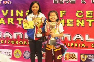 MIND BOARD WIZARDS. Mhage Gerriahlou Sebastian of Flora, Apayao (left), Mecel Angela Gadut of Candon City and Brylle Gever Vinluan (not in photo) will be competing in the upcoming ASEAN + Age Group Chess Championship in Vietnamas theymade it toTop 3 of the 2017 Grand Finals of the National Age Group Chess Championship held in Cebu City last May2-10, 2017. (May 14, 2017) By: GERRIAHZON SEBASTIAN